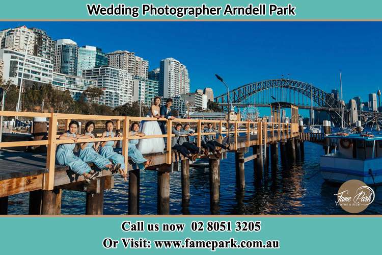 Photo of the Groom and the Bride with the entourage at the bridge Arndell Park NSW 2148