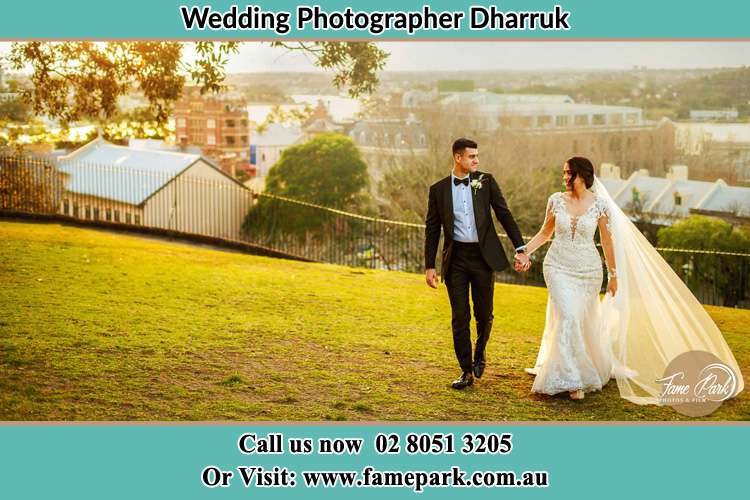 Photo of the Groom and the Bride walking at the yard Dharruk NSW 2770