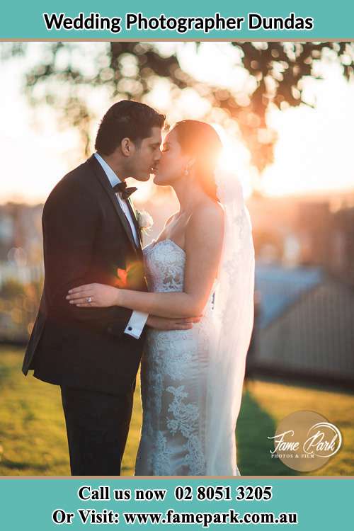 Photo of the Groom and the Bride kissing at the yard Dundas NSW 2117