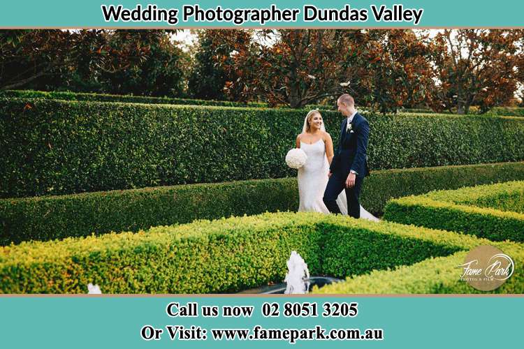 Photo of the Bride and the Groom walking at the garden Dundas Valley NSW 2117