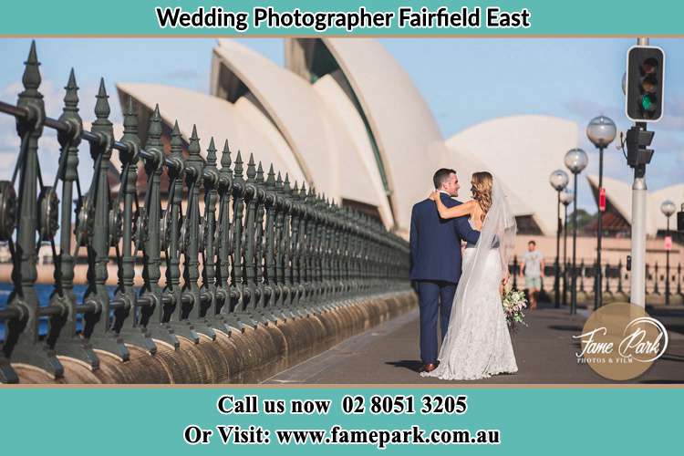 The Groom and the Bride walking towards the Sydney Grand Opera House Fairfield East NSW 2165