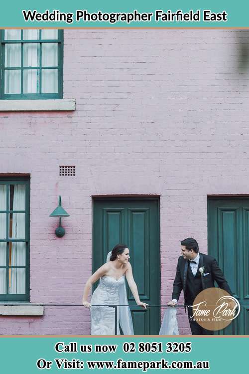 Photo of the Groom and the Bride looking each other at the balcony Fairfield East NSW 2165