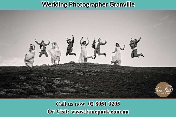 Jump shot photo of the Groom and the Bride with the entourage Granville NSW 2142