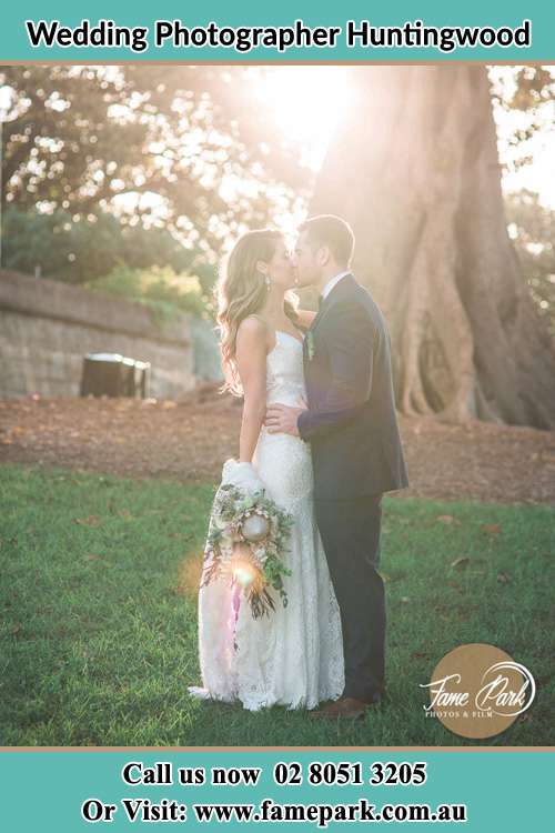 Photo of the Bride and the Groom kissing at the yard Huntingwood NSW 2148