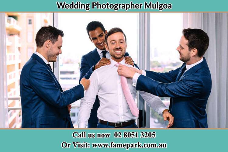 Photo of the Groom helping by the groomsmen getting ready Mulgoa NSW 2745