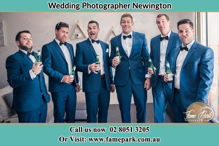 The groom and his groomsmen striking a wacky pose in front of the camera Newington NSW 2127