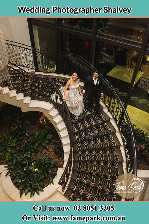 Photo of the Bride and the Groom going down the stair Shalvey NSW 2770