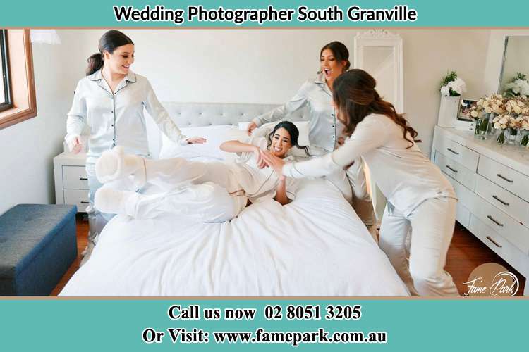 Photo of the Bride and the bridesmaids playing on bed South Granville NSW 2142