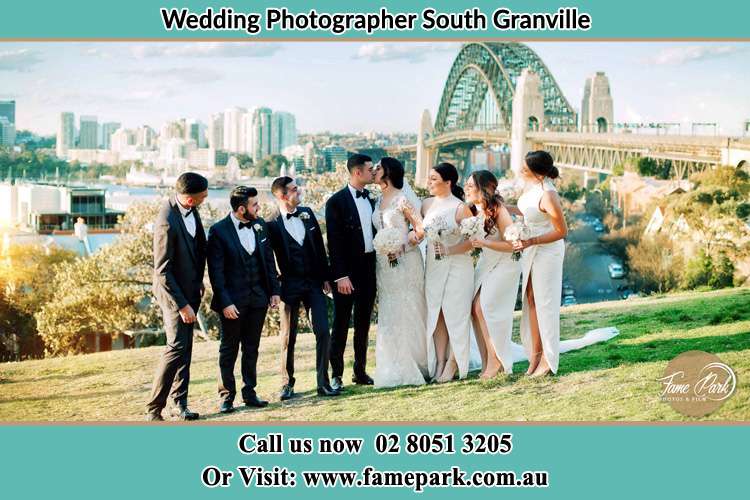 Photo of the Groom and the Bride with the entourage near the bridge South Granville NSW 2142