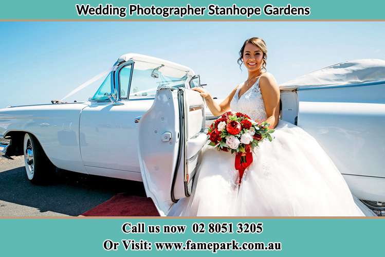 Photo of the Bride outside the bridal car Stanhope Gardens NSW 2768