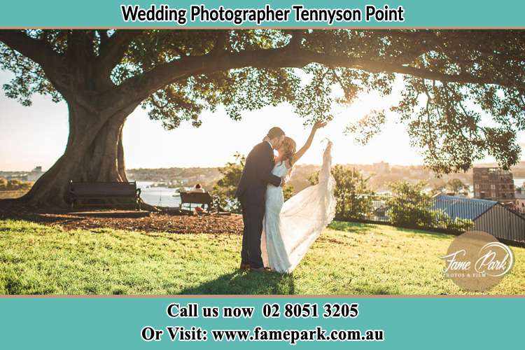 Photo of the Bride and the Groom kissing under the tree Tennyson Point NSW 2111