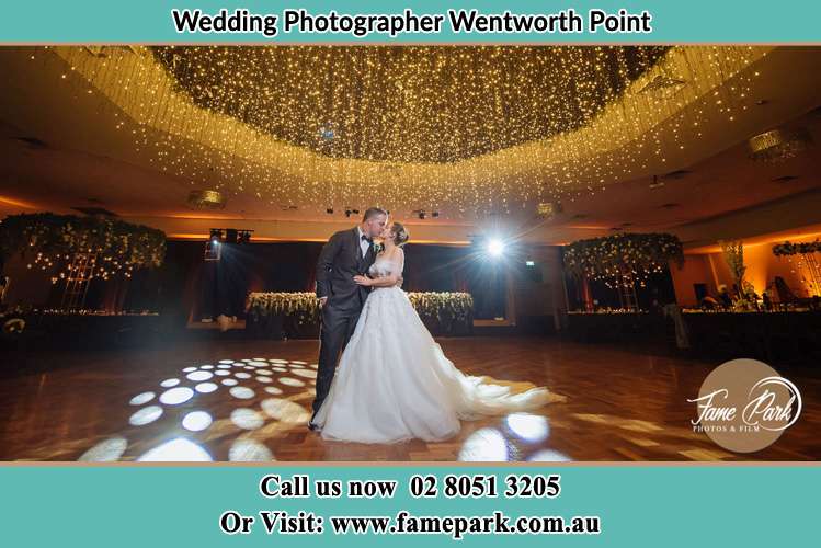 Photo of the Groom and the Bride kissing on the dance floor Wentworth Point NSW 2127